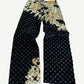 Louis Vuitton bleach monogram jeans back view with tonal LV leather pocket tag and flared hem