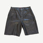 Bottega Desires black leather shorts front with tonal Bottega Desires varsity arch logo across thighs