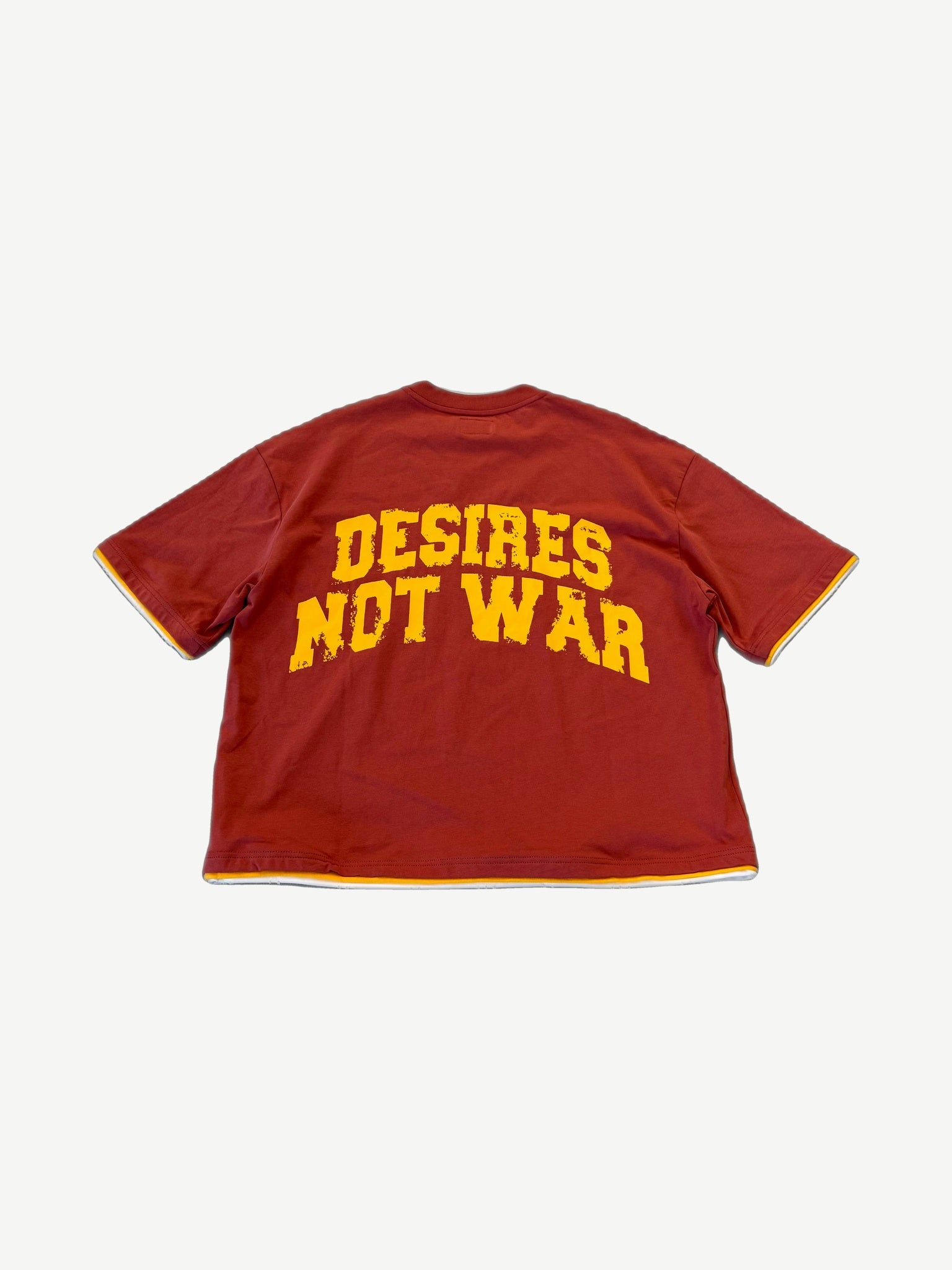 Bottega Desires red tee back with yellow arched Desires Not War varsity slogan graphic