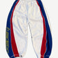 Hidden Season white athletic sweatpants with blue and red racing stripe side panels and yellow brand logo