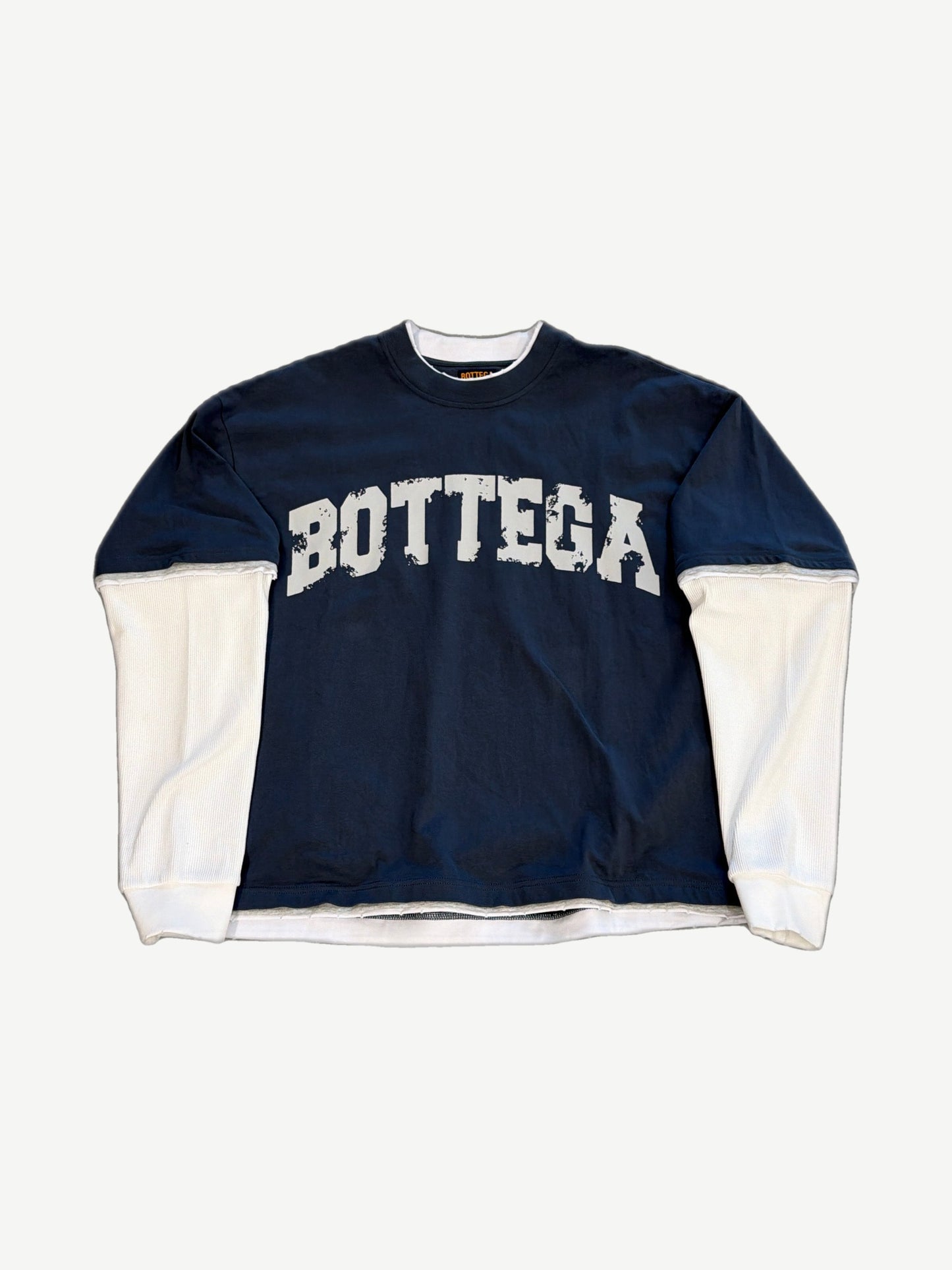 Bottega Desires navy long sleeve crewneck front, distressed white BOTTEGA arch print and ribbed contrast cuffs.