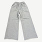 Happy Memories Don't Die gray sweatpants back view showing studded HMDD lettering and circular badges.