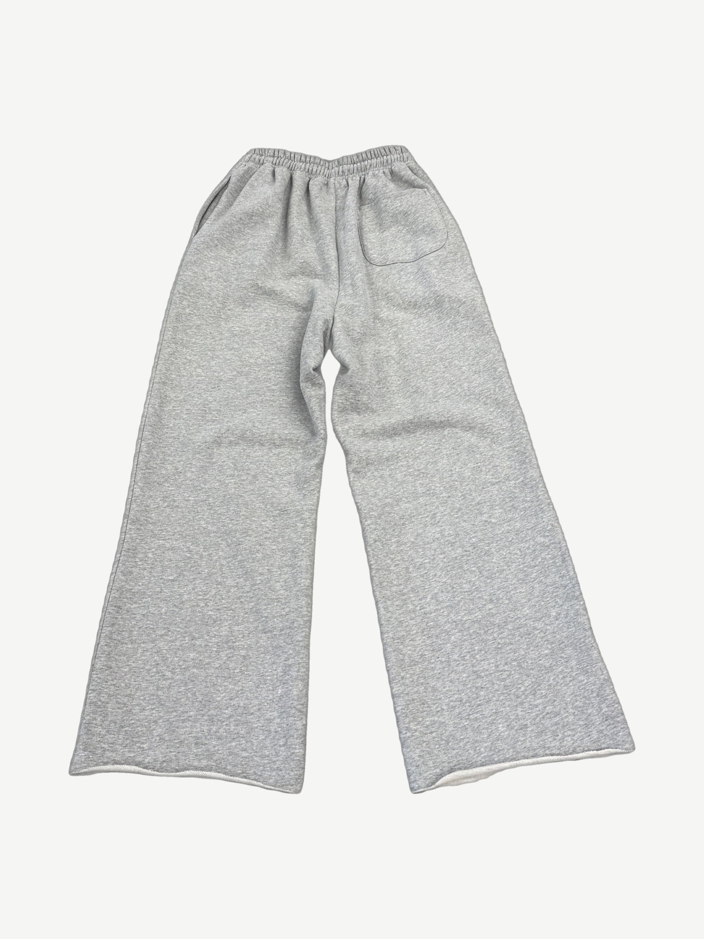 Happy Memories Don't Die gray sweatpants back view showing studded HMDD lettering and circular badges.