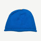 Chrome Hearts blue cashmere knit beanie back view with rolled cuff and small silver crown emblem at peak.