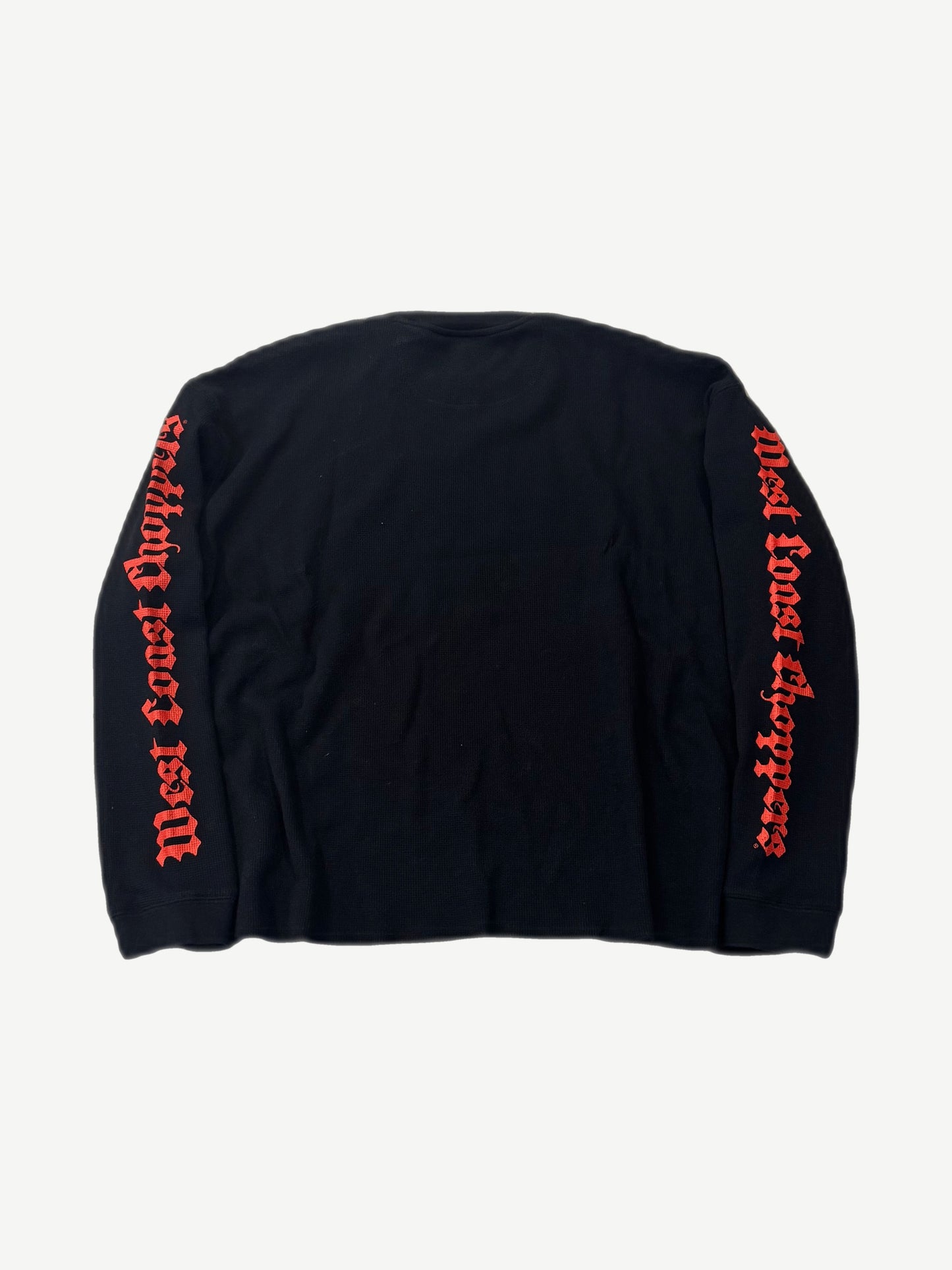 Back of West Coast Choppers black thermal with red gothic script running down both sleeves