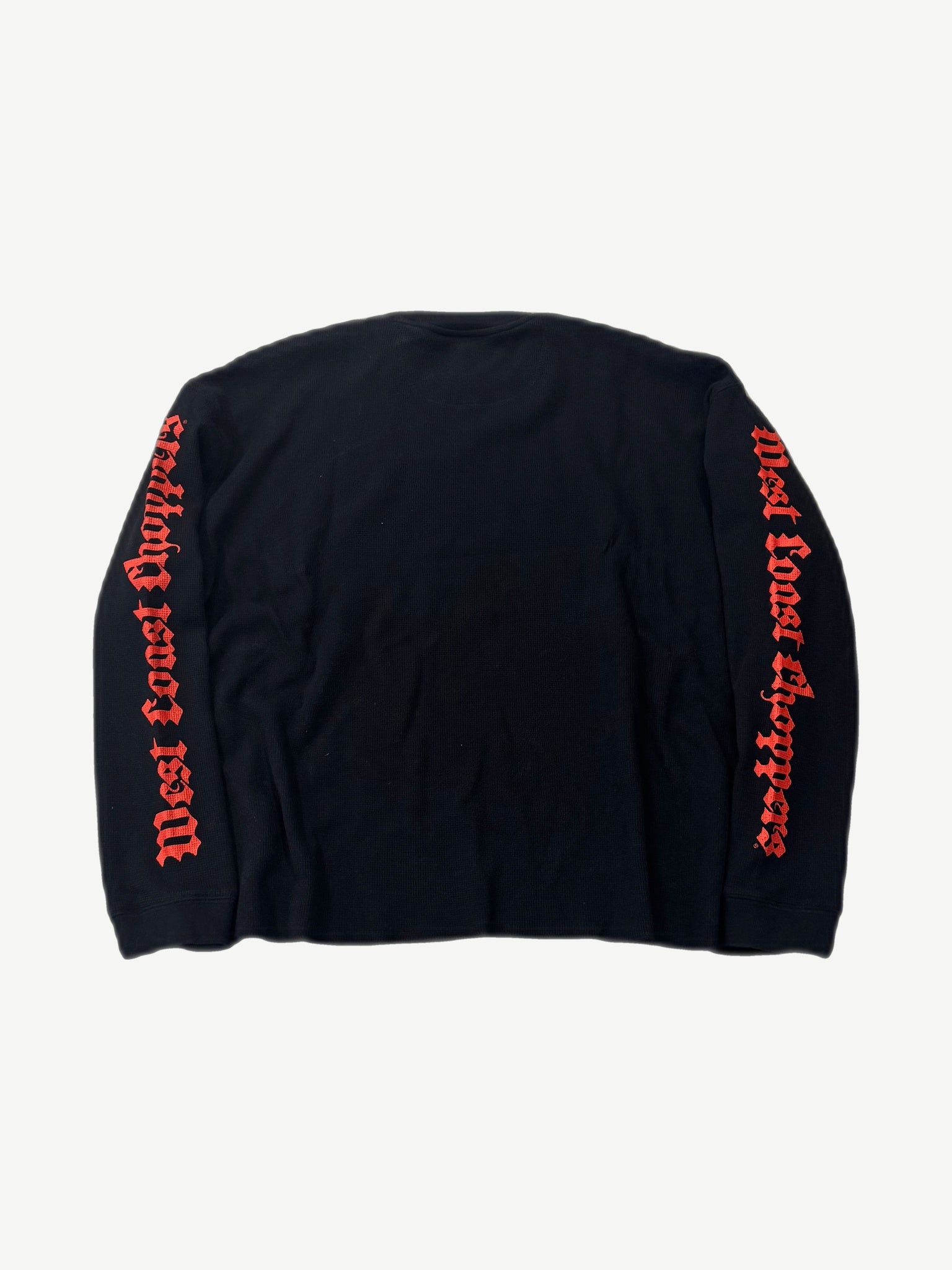 Back of West Coast Choppers black thermal with red gothic script running down both sleeves