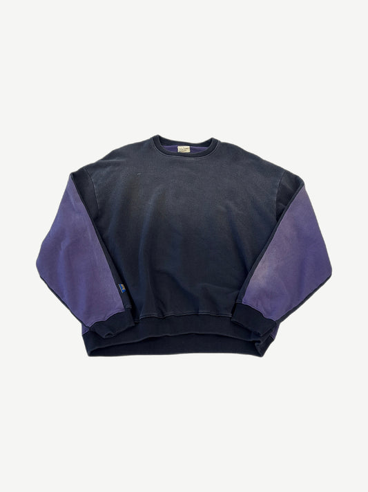 Kapital two-tone crewneck sweatshirt front in faded black body with contrasting purple sleeves and ribbed hem