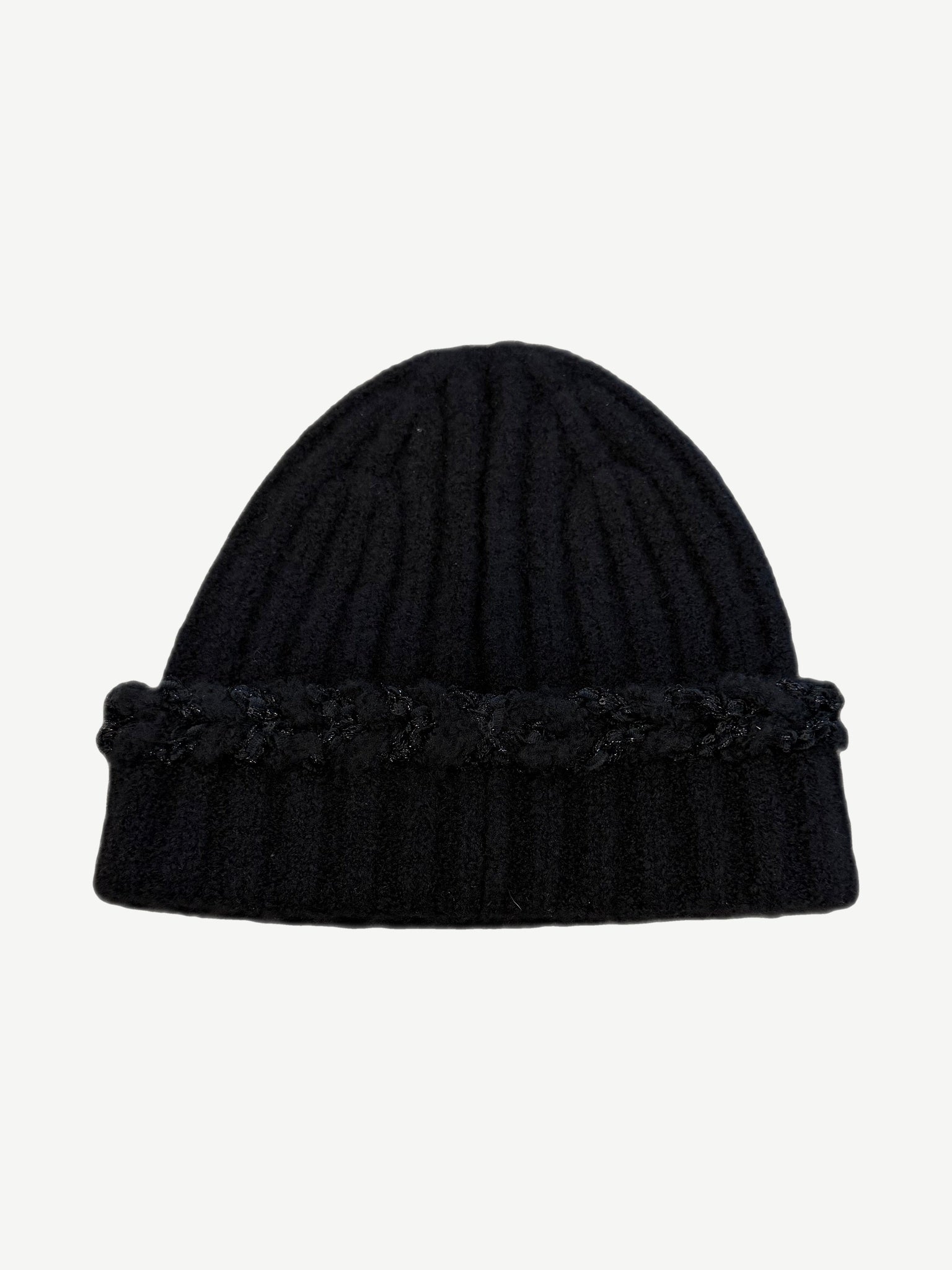Chanel black ribbed cashmere beanie shown from side with subtle sequin texture and folded knit cuff.