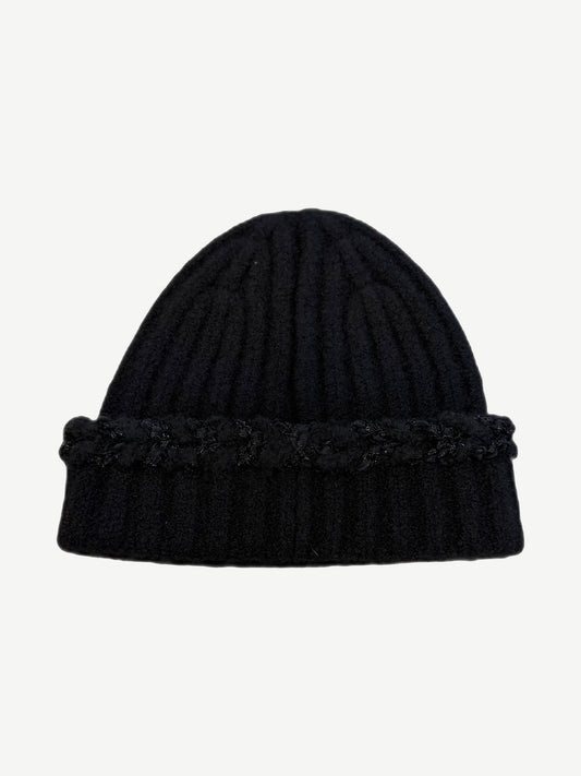 Chanel black ribbed cashmere beanie shown from side with subtle sequin texture and folded knit cuff.