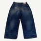 Back of Acne Studios baggy mid blue 2023M jeans showing faded seat, rear patch pockets and wide leg.