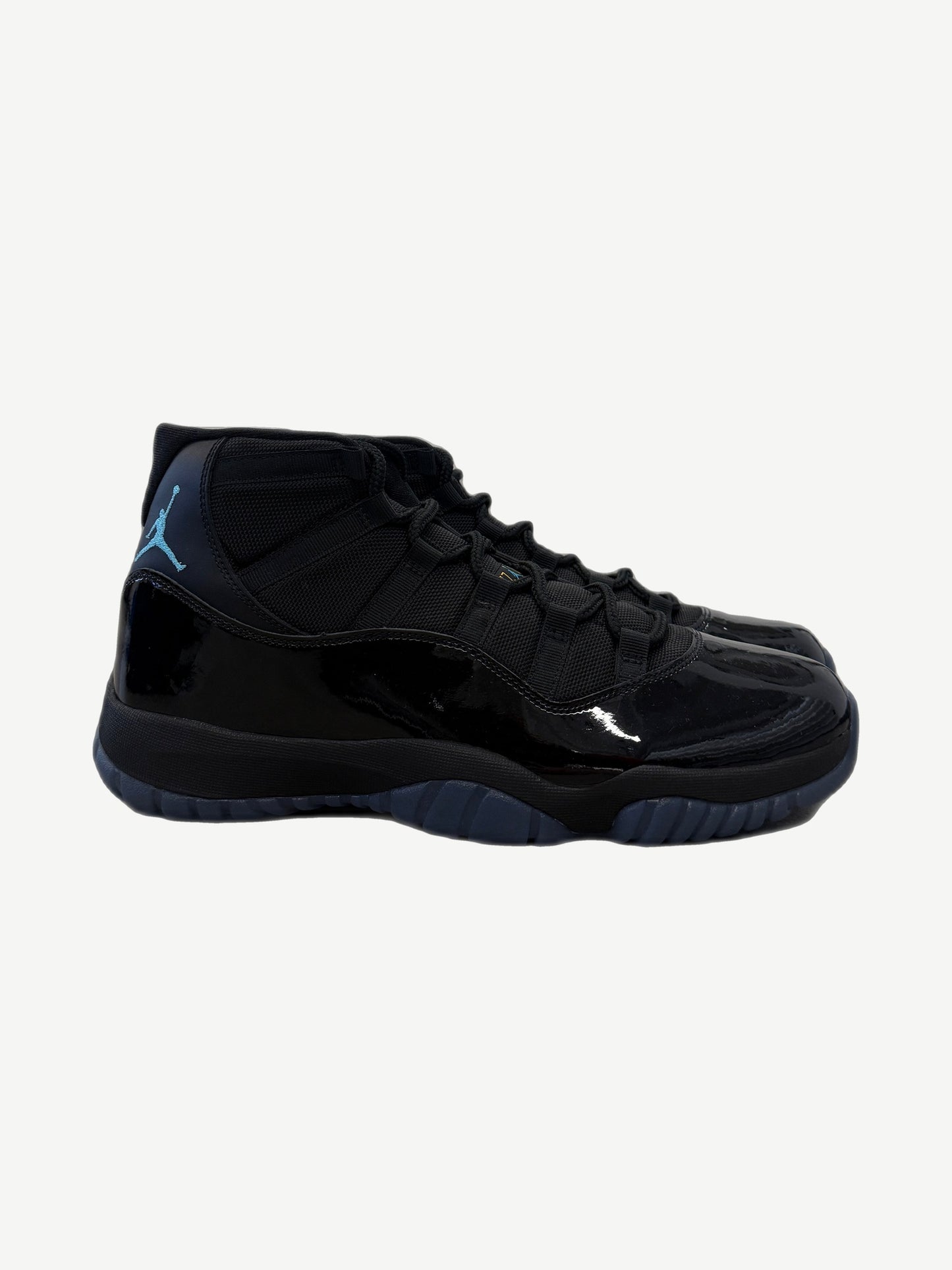Air Jordan 11 Retro Gamma Blue 2025 sneaker side profile showing patent leather mudguard and mesh upper.