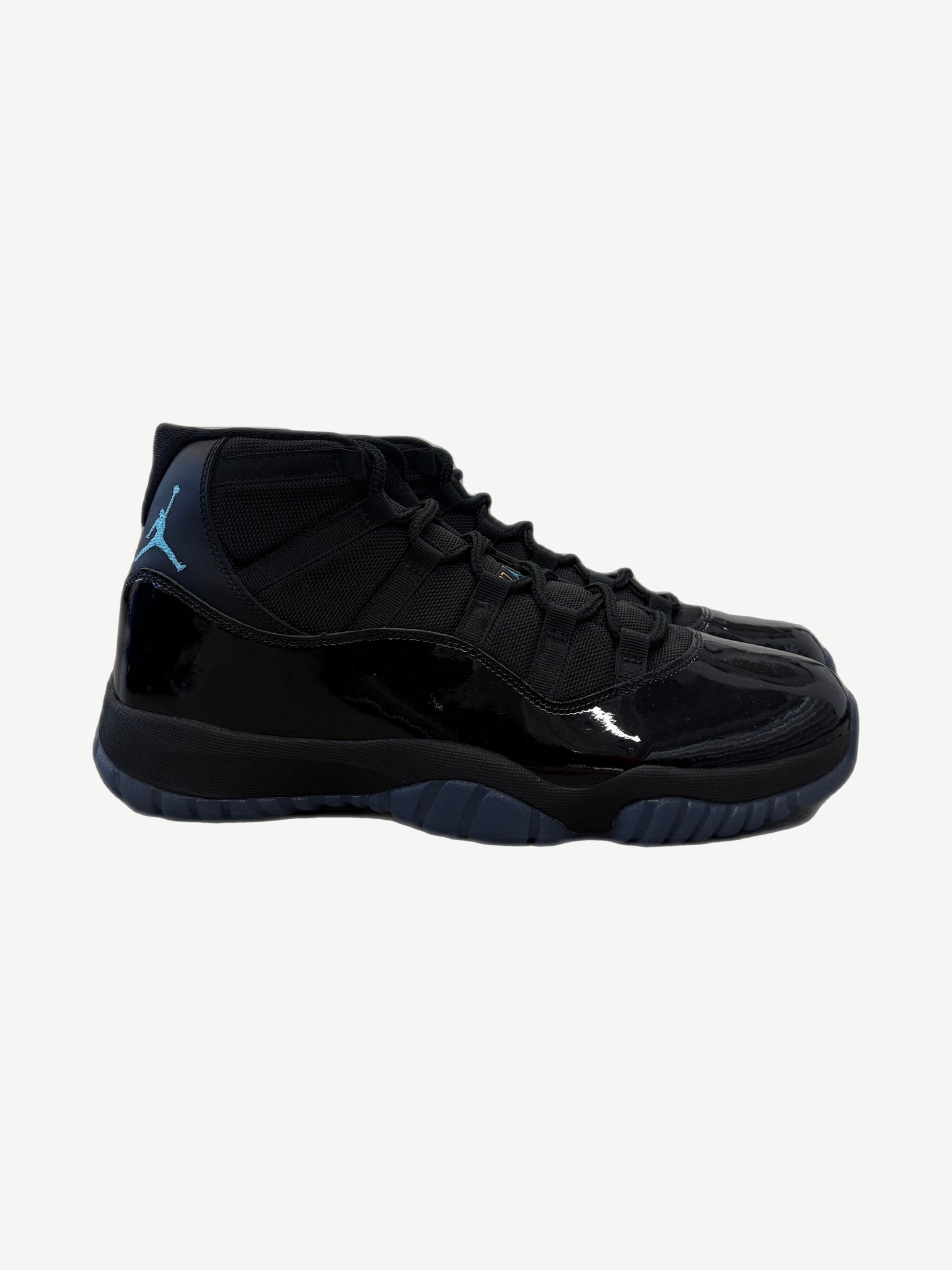 Air Jordan 11 Retro Gamma Blue 2025 sneaker side profile showing patent leather mudguard and mesh upper.