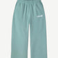 HMDD seafoam green organic cotton sweatpants front view with elastic drawstring waist and cuffed ankles
