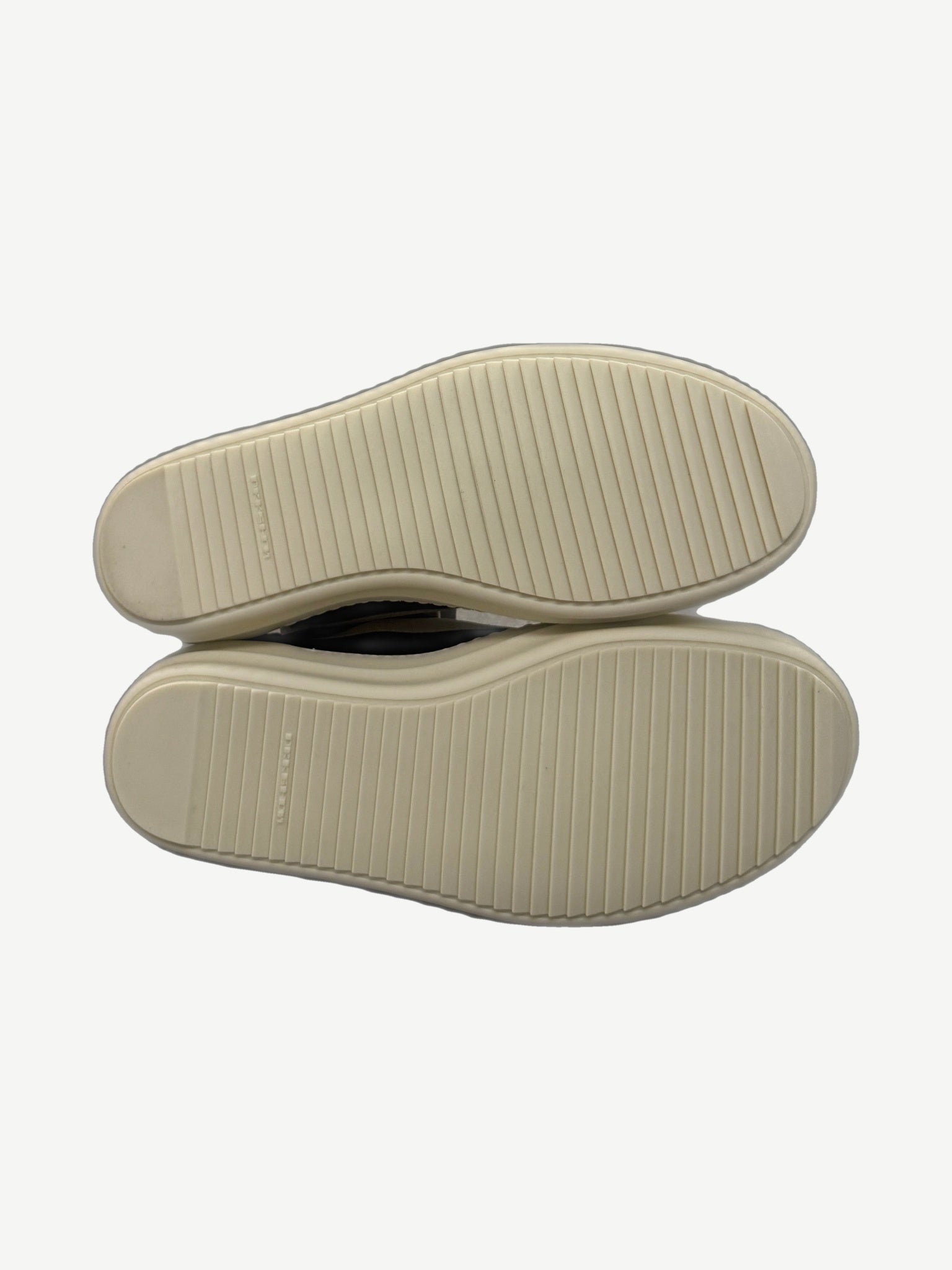 Rick Owens DRKSHDW black Vintage sneakers sole view showing ribbed cream rubber tread pattern and branded heel.