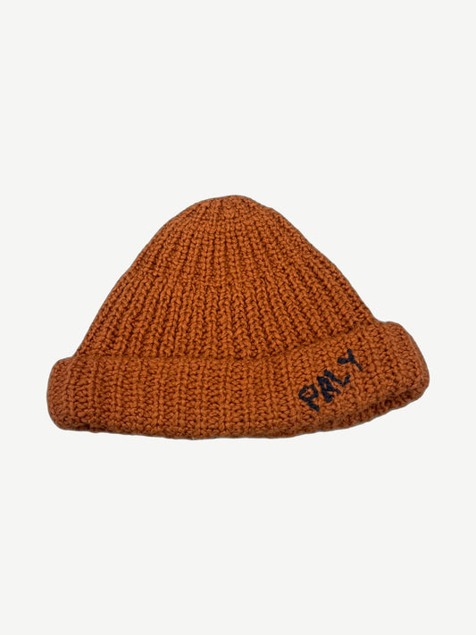 Paly Hollywood hand-knit chunky ribbed beanie in burnt orange with navy PALY logo embroidered on cuff.