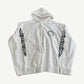 Chrome Hearts white cotton hoodie front with small horseshoe chest logo and black floral cross sleeve prints