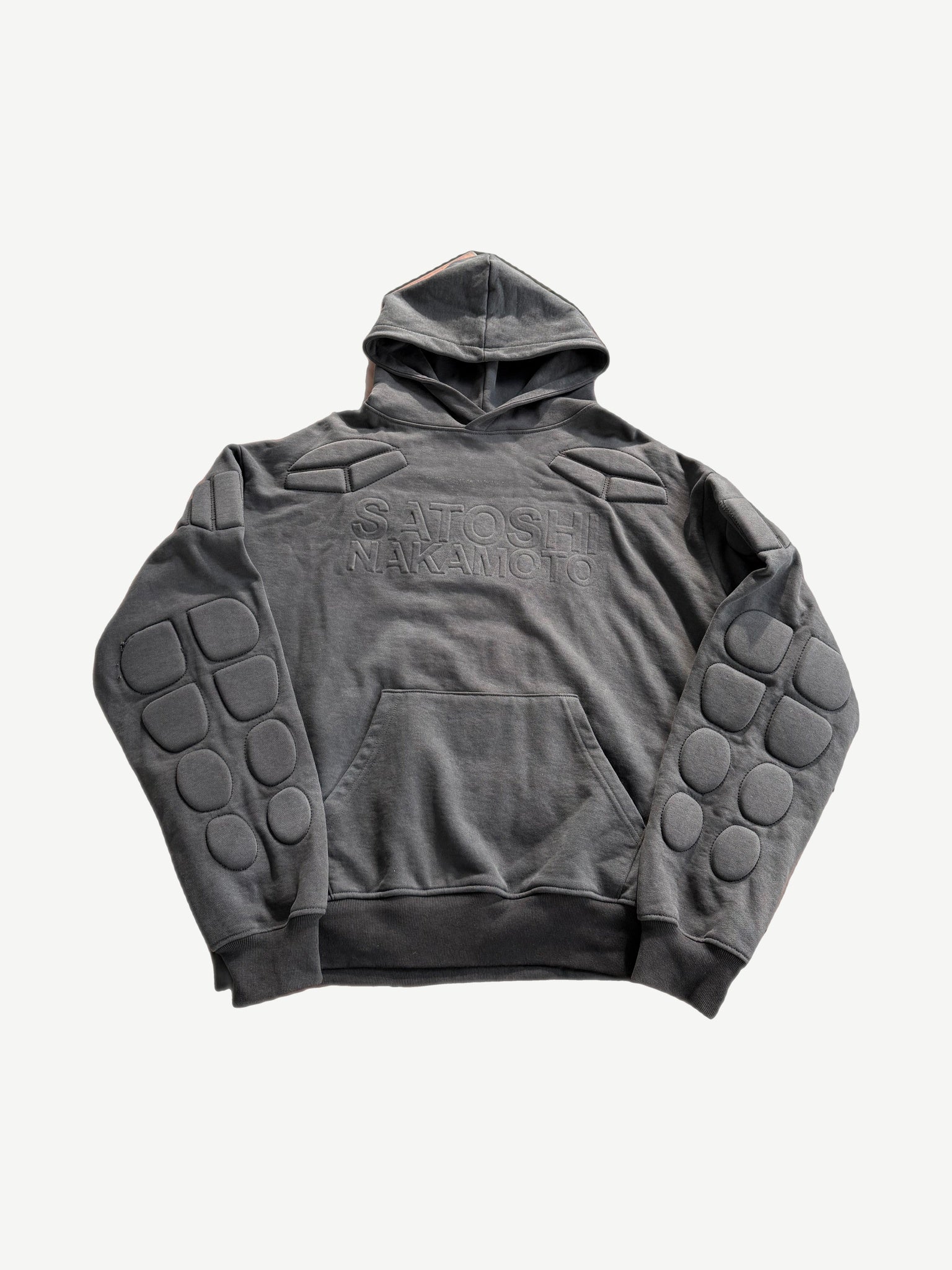 Satoshi Nakamoto Moto hoodie in washed black with moto-inspired paneling and zip detailing at front.