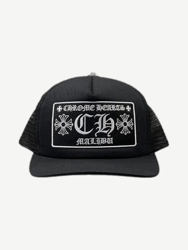 Chrome Hearts black foam-front mesh trucker hat with white CH Malibu gothic patch and cross emblems