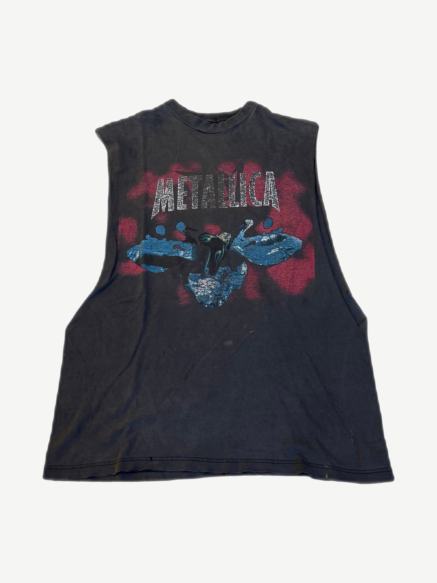 Vintage Metallica sleeveless cutoff tee with cracked METALLICA logo and blue red devil album graphic.