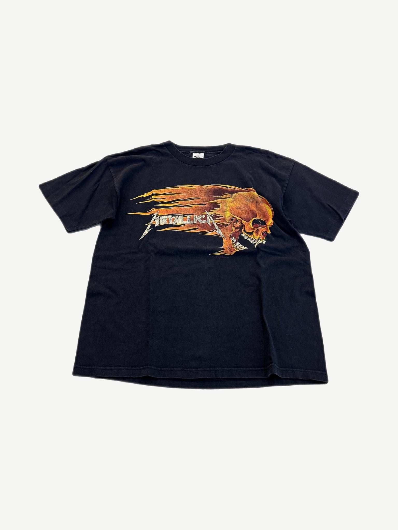 Vintage Metallica black tee front with Pushead flaming skull screaming graphic over silver band logo