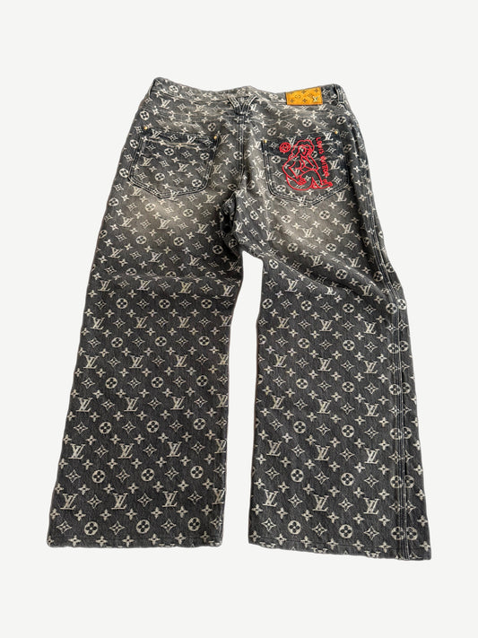 Louis Vuitton monogram denim pants back showing five-pocket styling and tonal black LV embossed jacquard