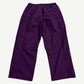 Supreme Umbro plum ripstop track pants back view with elastic waist, back pocket and tonal side seam piping.