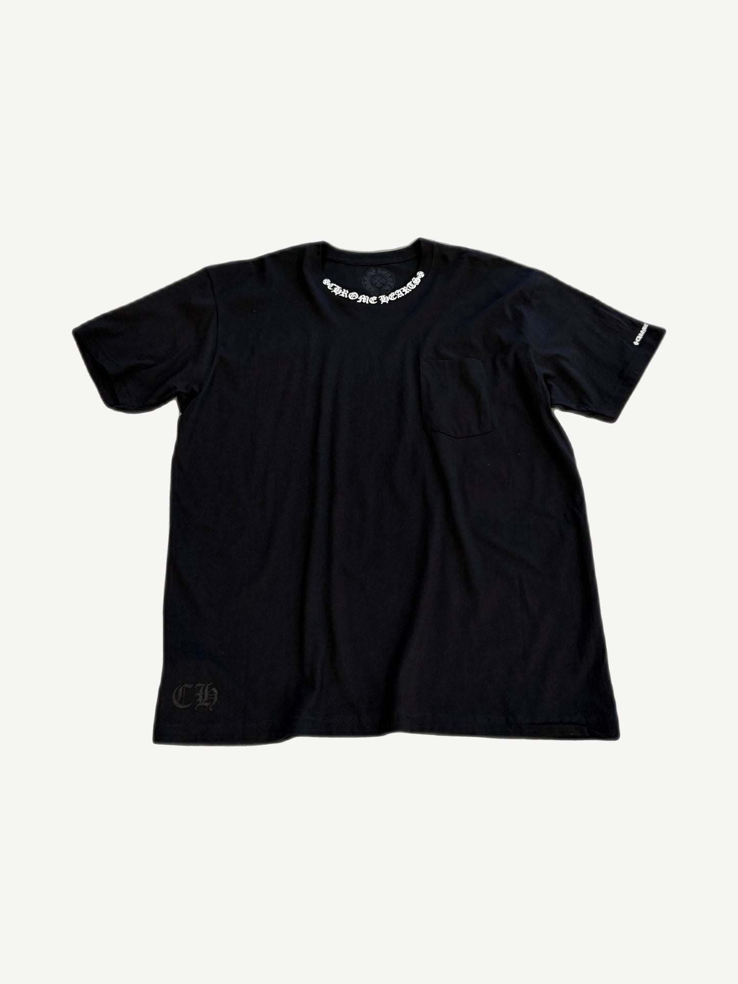 Chrome Hearts black tee front with chest pocket and small white neck stamp gothic CH logo print.