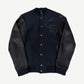 Chrome Hearts navy wool varsity jacket with black leather sleeves, CH gothic logo patch and cross button details