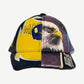 Supreme MM6 Maison Margiela split 6-panel cap front mixing navy twill, yellow Michigan football and eagle print