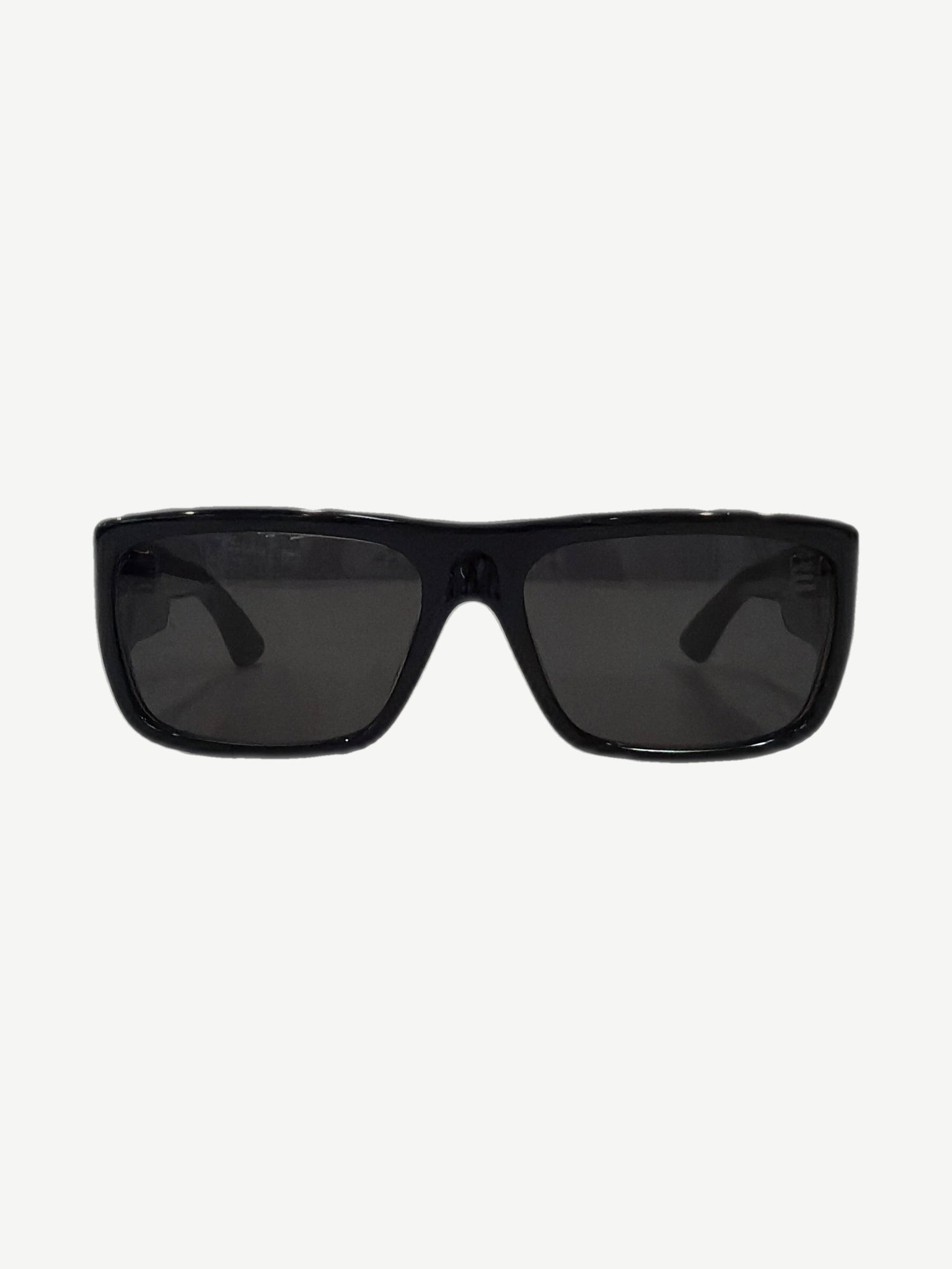 Chrome Hearts black sunglasses folded view with engraved Yer Born Again temple text and sterling silver detail.