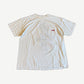Vintage white Marlboro tee front view with chest pocket and red Marlboro label tag on the pocket