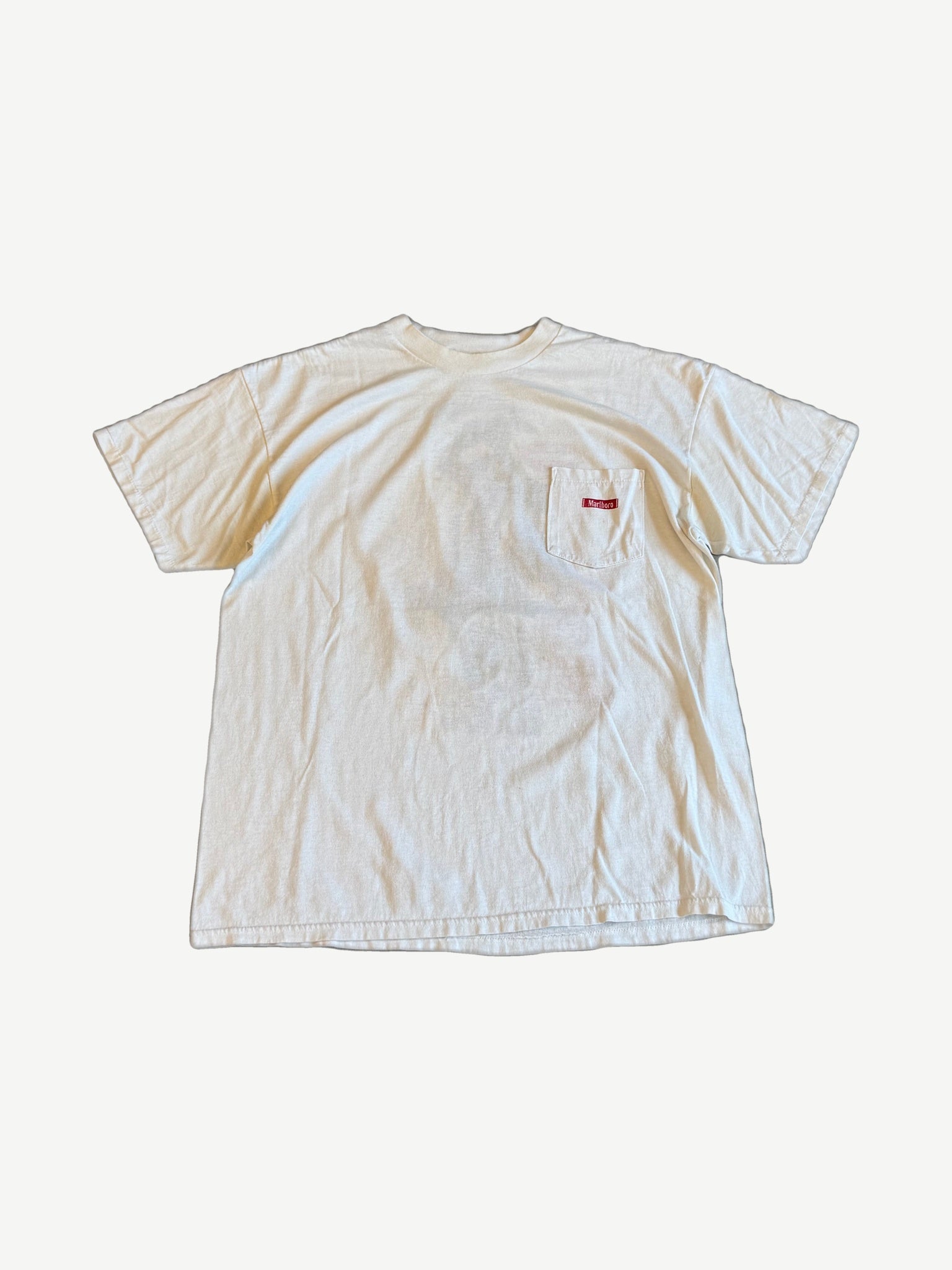 Vintage white Marlboro tee front view with chest pocket and red Marlboro label tag on the pocket