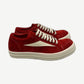 Rick Owens Carnelian vintage low-top sneakers in distressed grey leather with chunky white rubber sole.