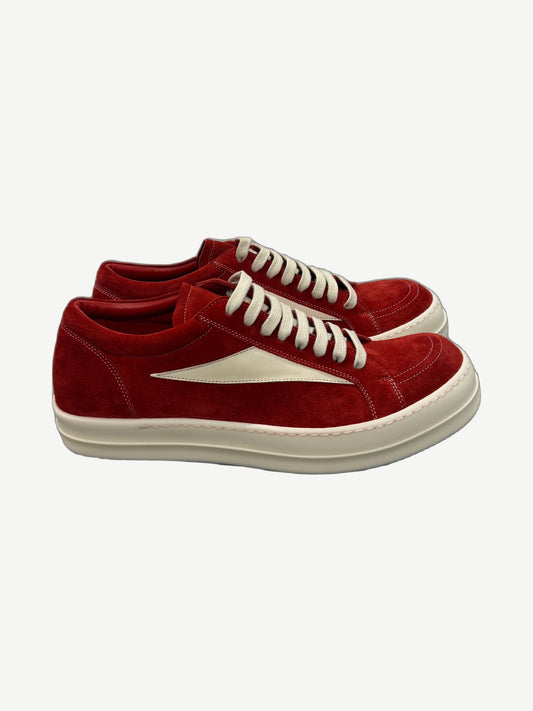 Rick Owens Carnelian vintage low-top sneakers in distressed grey leather with chunky white rubber sole.