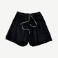 Rick Owens black suede wide-leg drawstring shorts front view with contrast cord and side vents