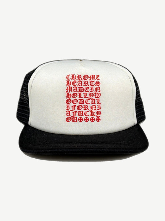 Chrome Hearts black trucker hat front with red and white eyechart text panel and white mesh side panels.