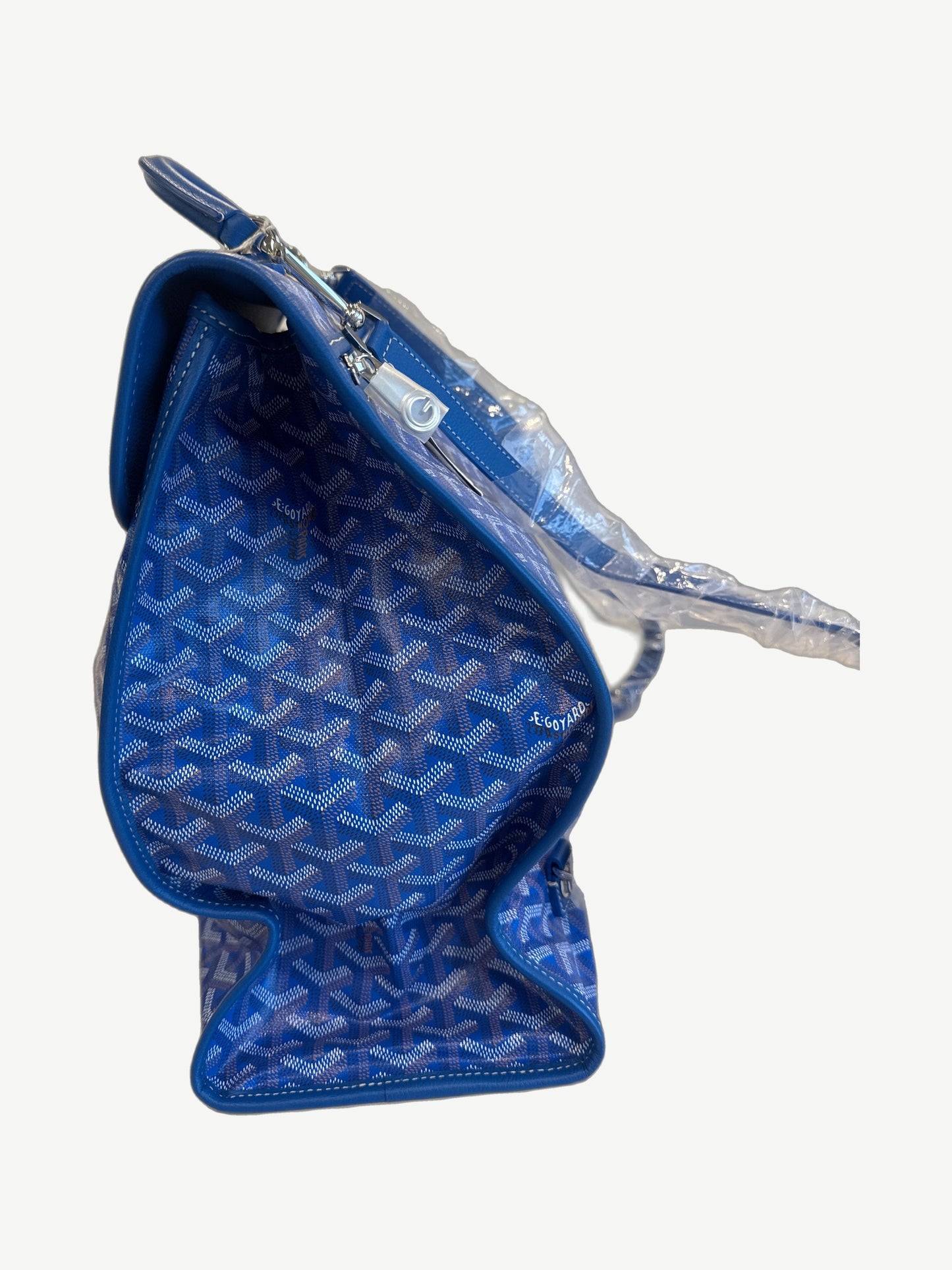 Goyard Saint Leger backpack side profile in blue chevron canvas with structured gusset and Goyard signature