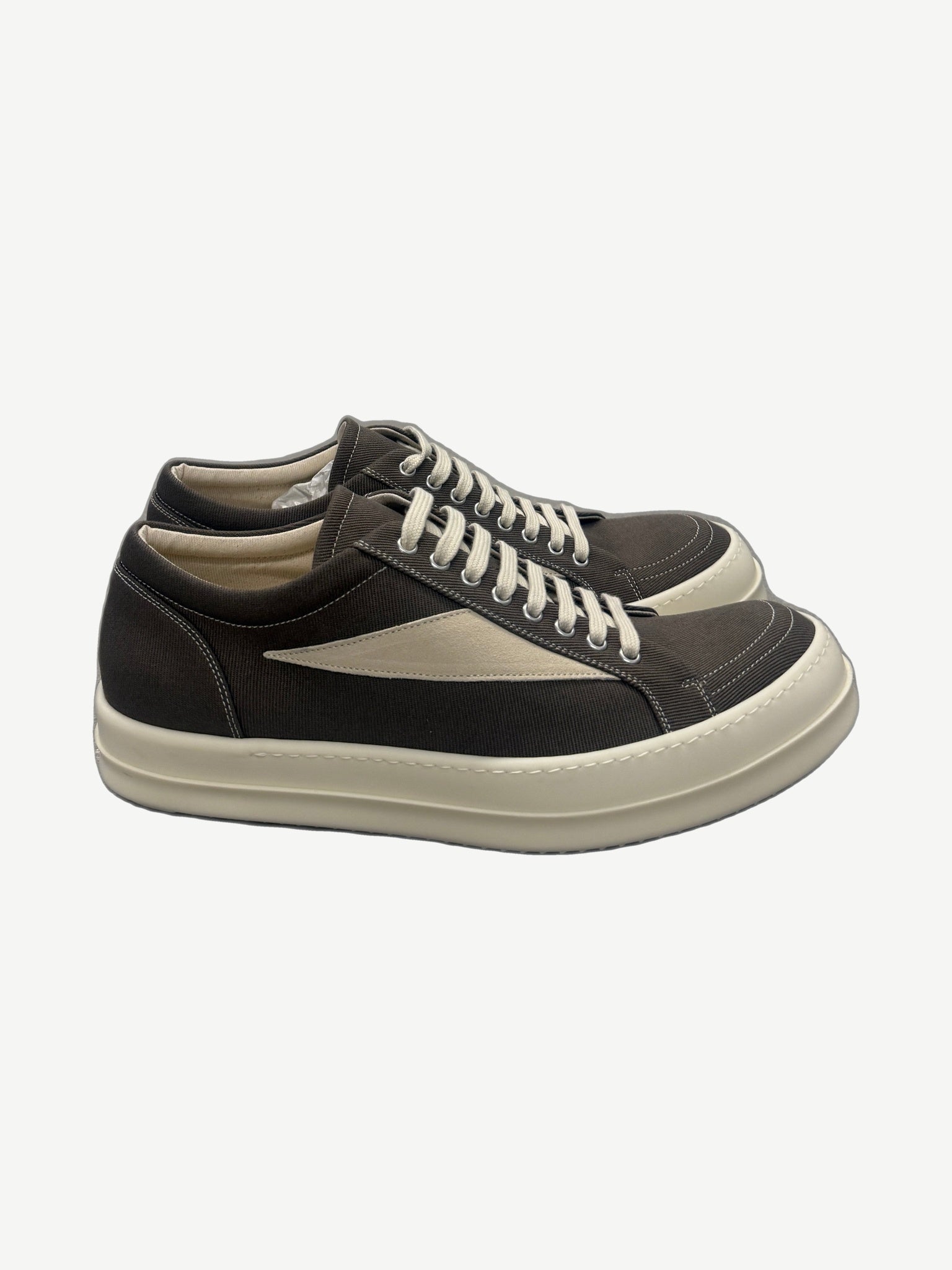 Rick Owens DRKSHDW Dark Dust vintage low-top sneakers side view with distressed canvas upper and rubber sole