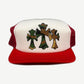 Chrome Hearts red mesh trucker hat front, white foam panel printed with three woodland camo crosses, red brim.