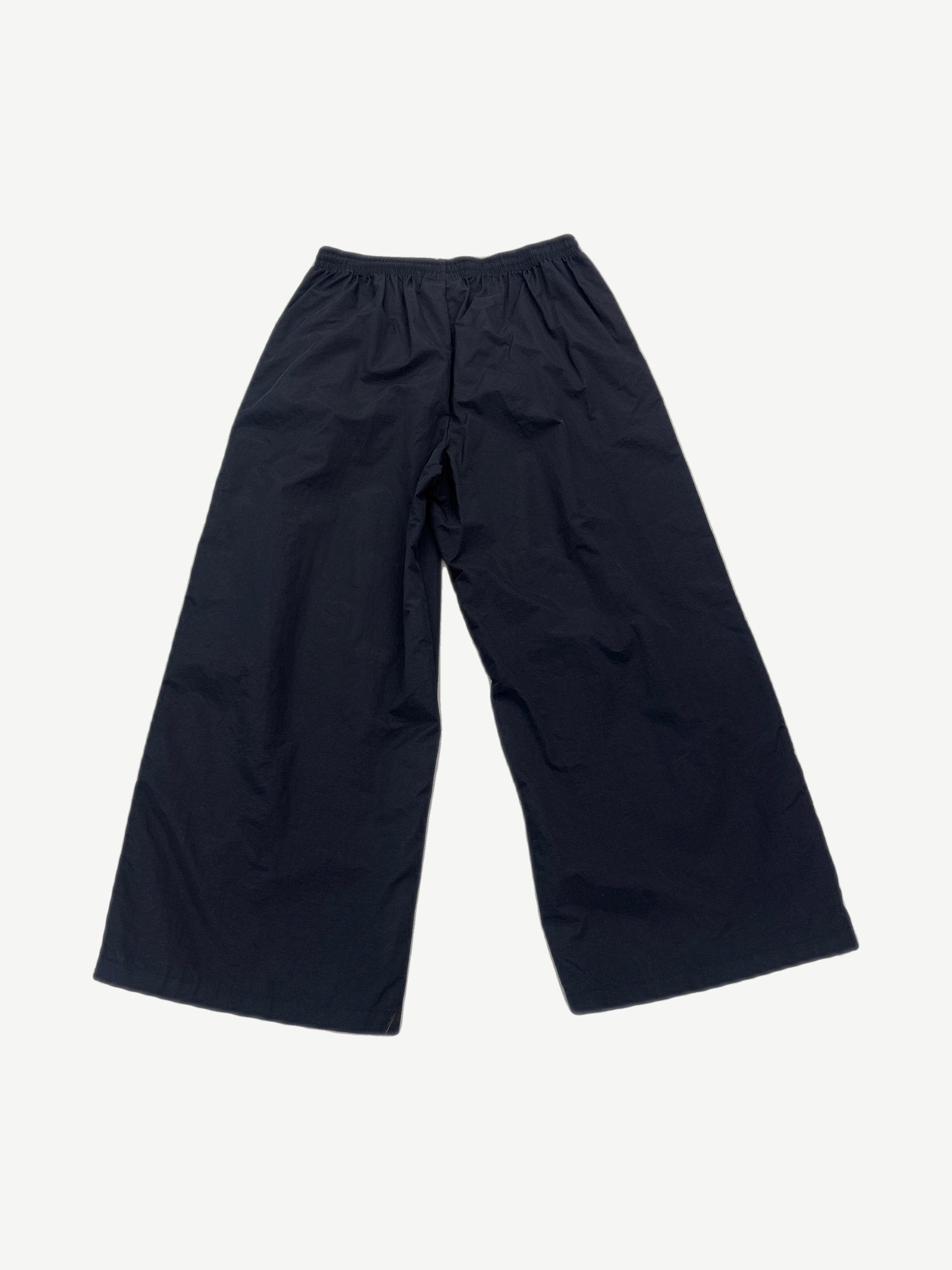 GV Gallery Raspberry Hills black wide-leg track pants back view, plain elasticated waist nylon shell
