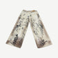 HMDD tan graffiti print wide-leg chino pants back view showing baggy fit and waistband detail