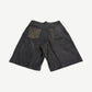 Raspberry Hills rust leather carpenter shorts back view with patch back pockets and contrast suede patch panels.
