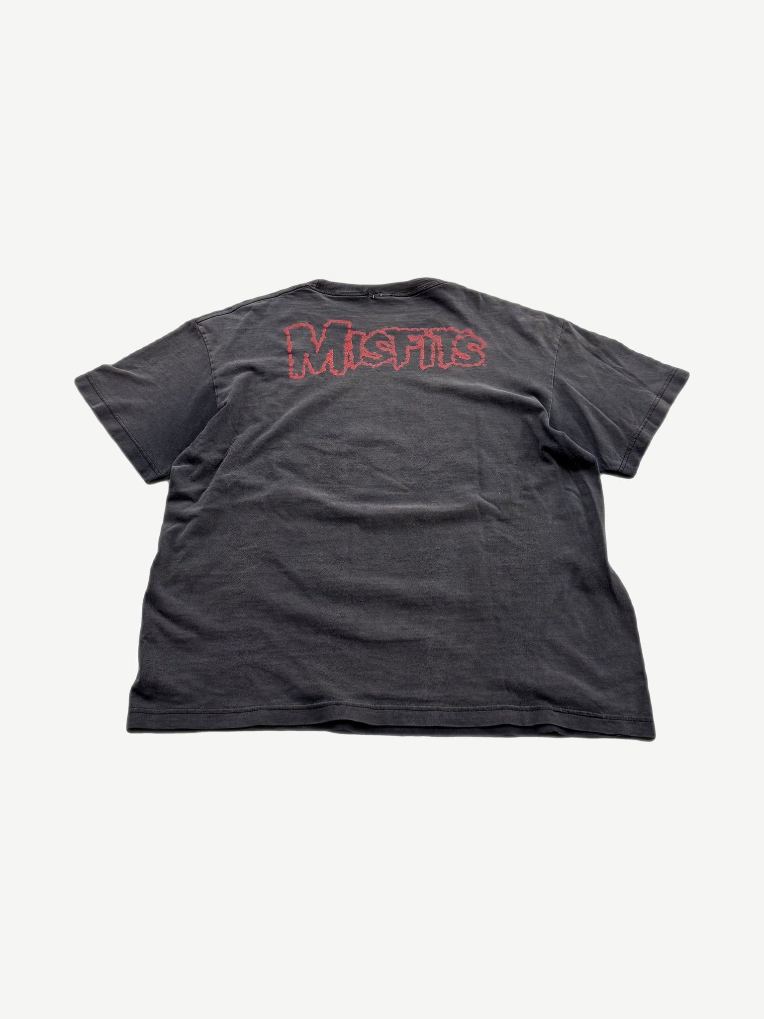 Back of vintage Misfits faded black tee with red outline Misfits logo print across upper back