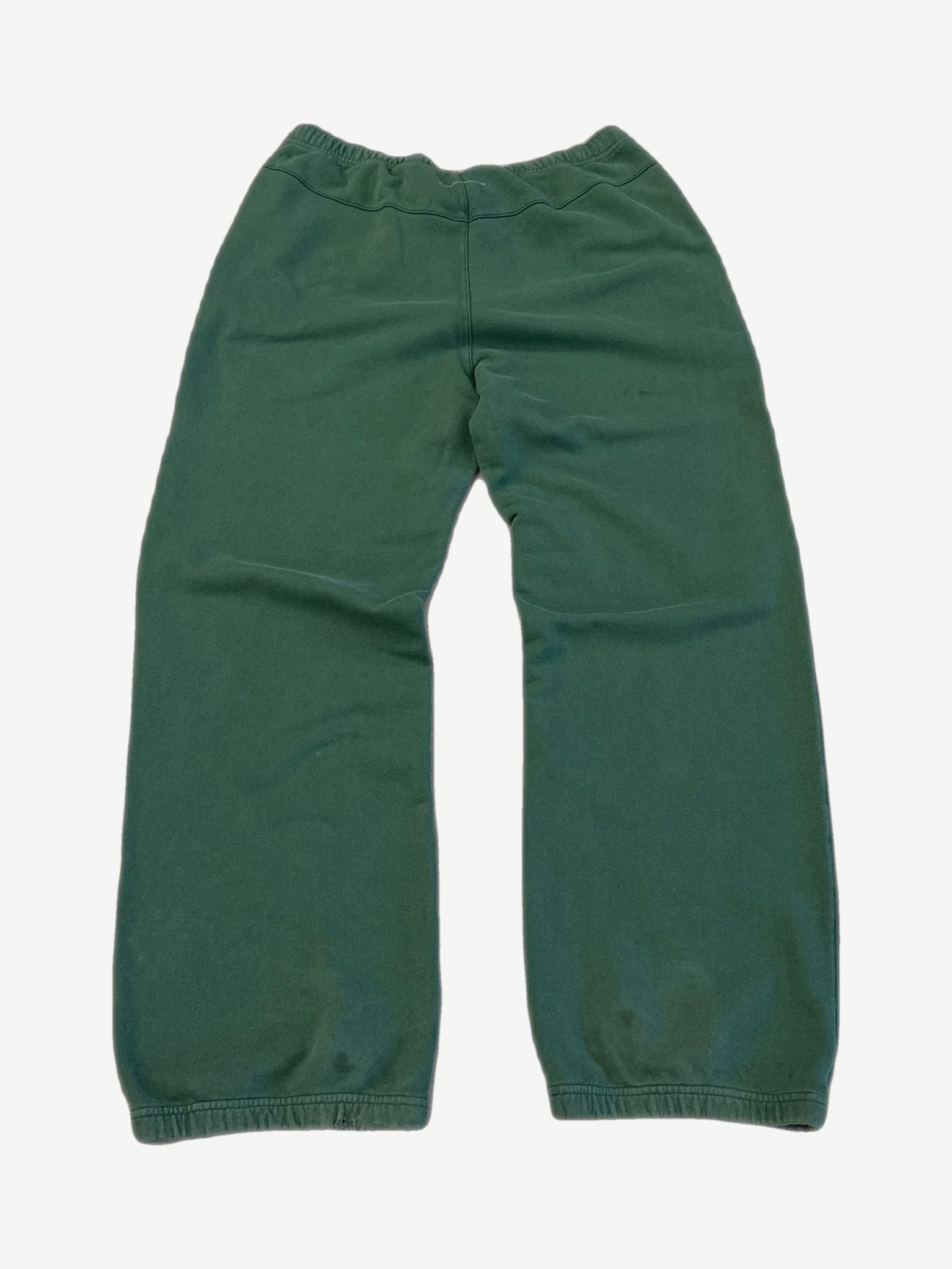 Back of MM6 Maison Margiela green sweatpants with elastic waistband and cuffed straight leg silhouette