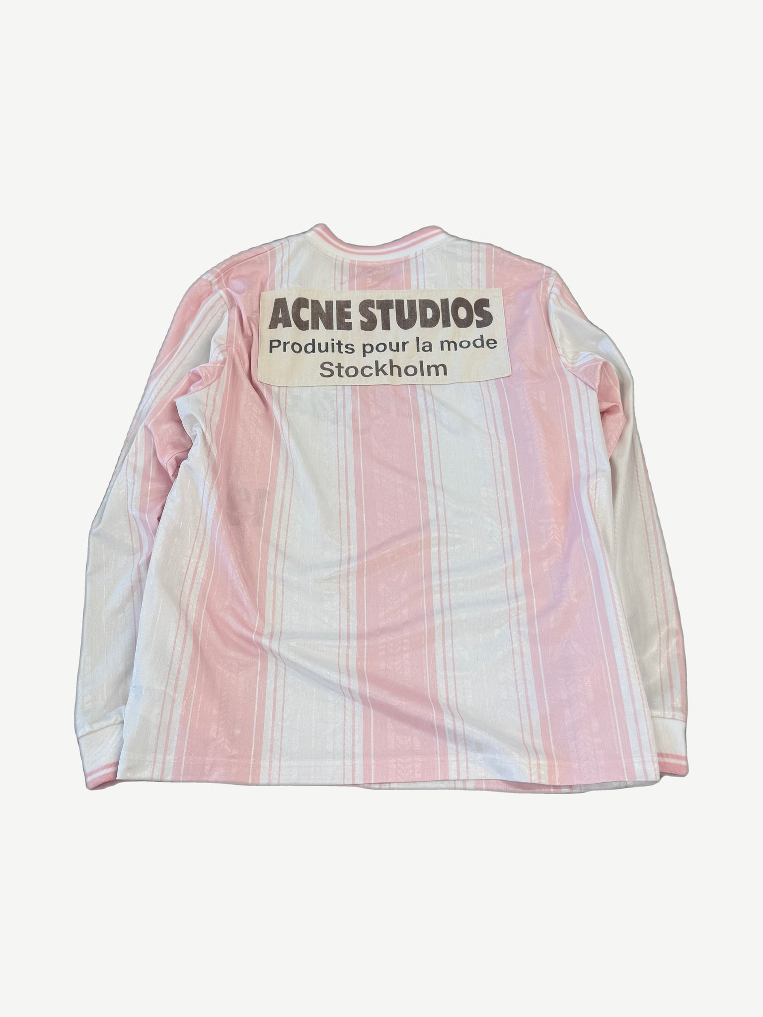 Acne Studios pink soccer jersey longsleeve back view with white stripe paneling and ventilated mesh fabric