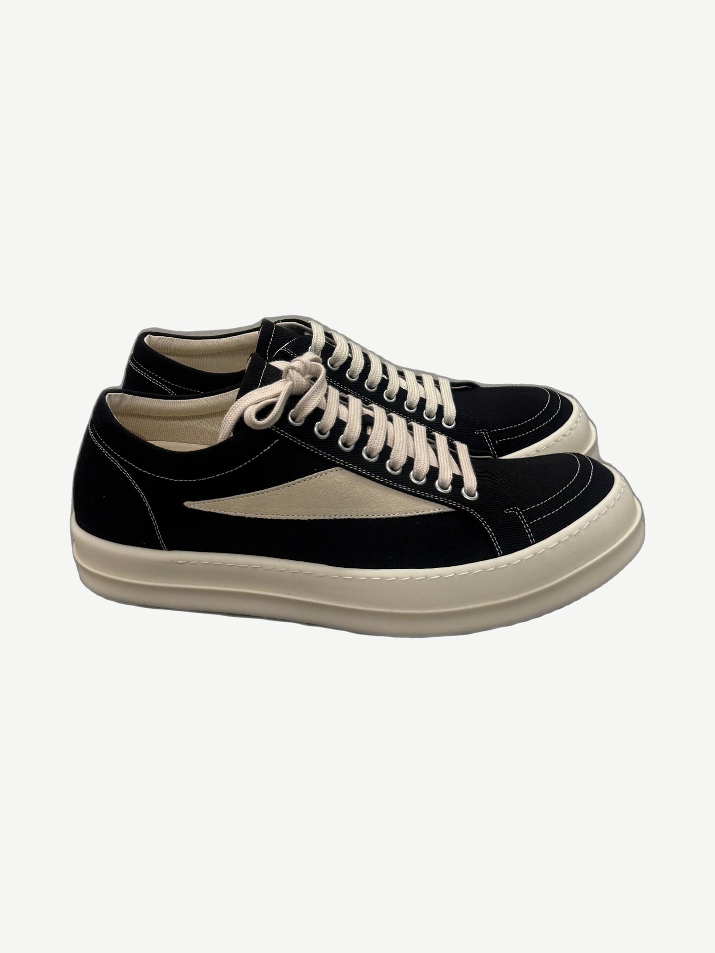Rick Owens DRKSHDW Vintage low sneakers in black canvas with cream suede side flash and chunky off-white rubber sole.