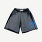 Bossi faded black mesh shorts front with blue rhinestone Bossi Old English logo on right leg