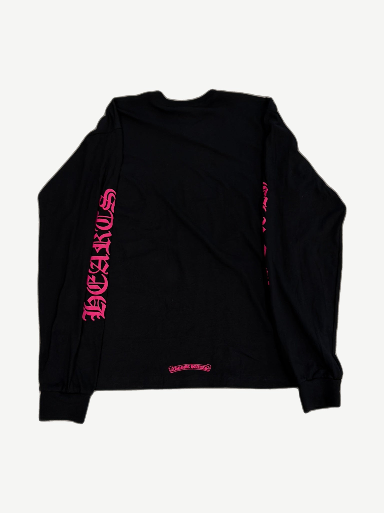 Chrome Hearts black longsleeve tee back with neon pink gothic sleeve lettering and small scroll logo at hem