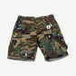 Gallery Dept green camo cargo shorts with painted white G patch on front leg, distressed hem detail