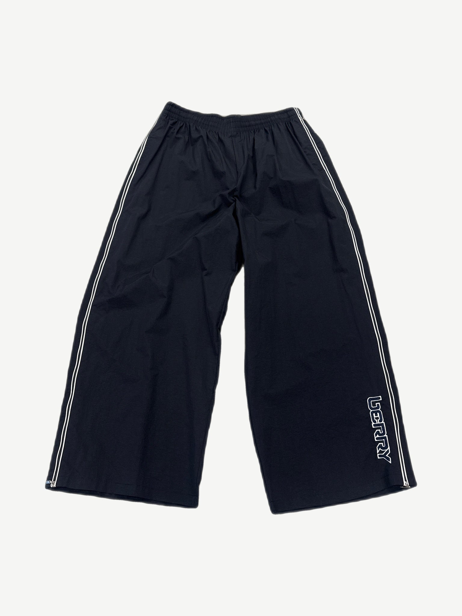 GV Gallery Raspberry Hills black wide-leg track pants front with white piping stripes and Berry leg logo